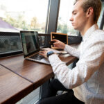men write data from card to laptop